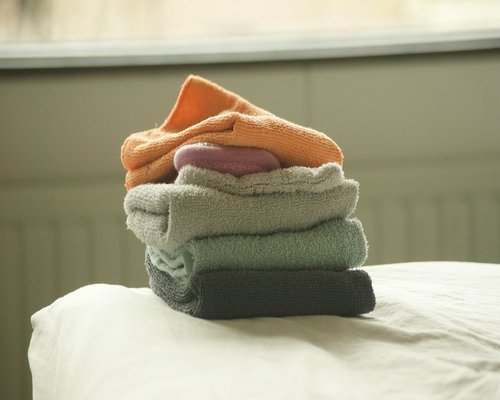 A neatly organized bedside table with soft personal elements